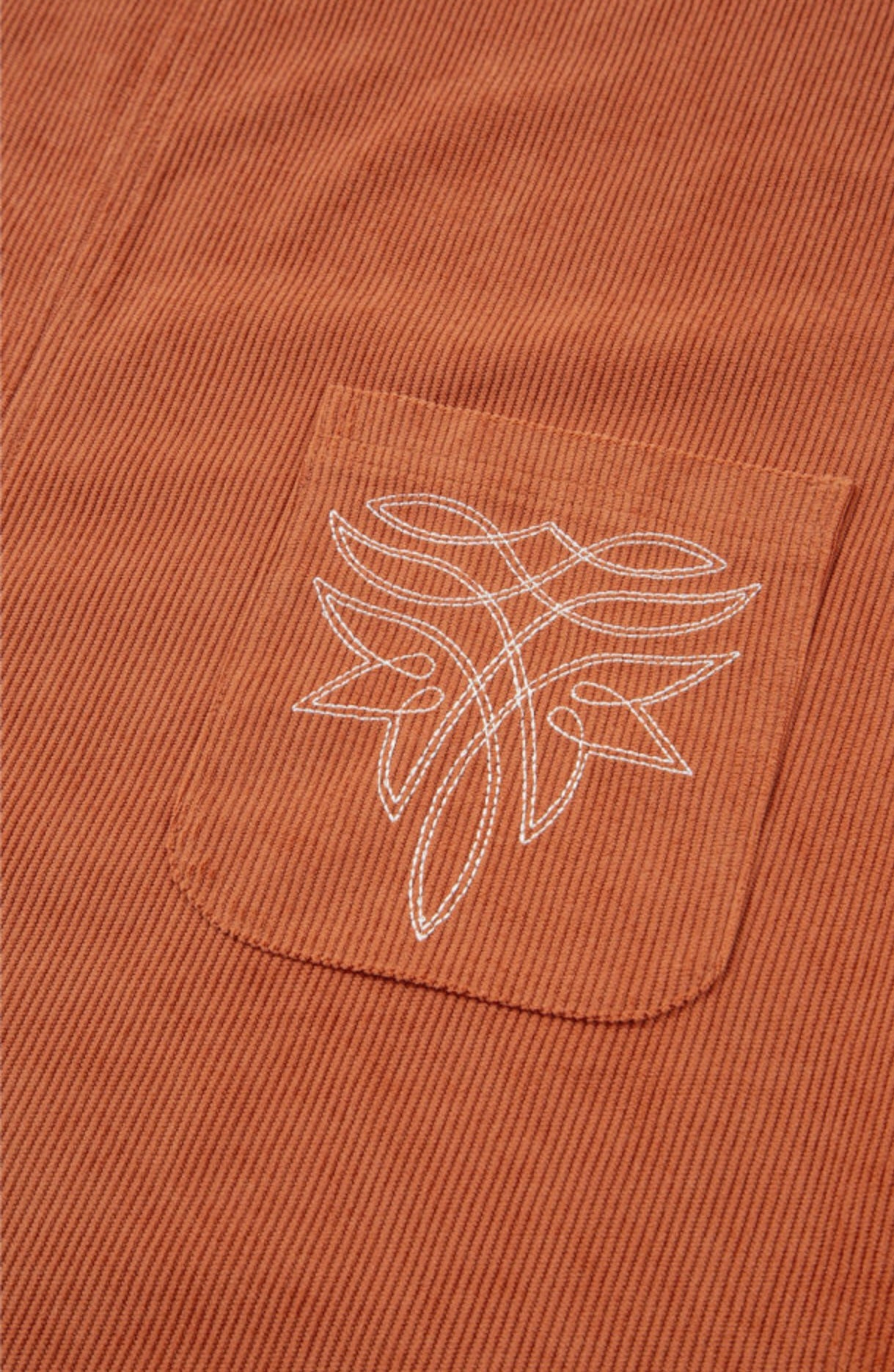 Sleeveless Rust colored dress with Accent Stitched Pocket Design
