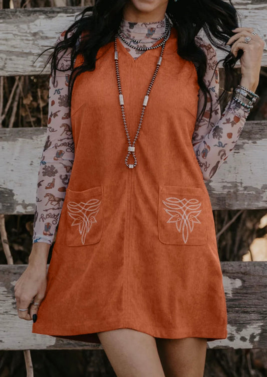 Sleeveless Rust colored dress with Accent Stitched Pocket Design