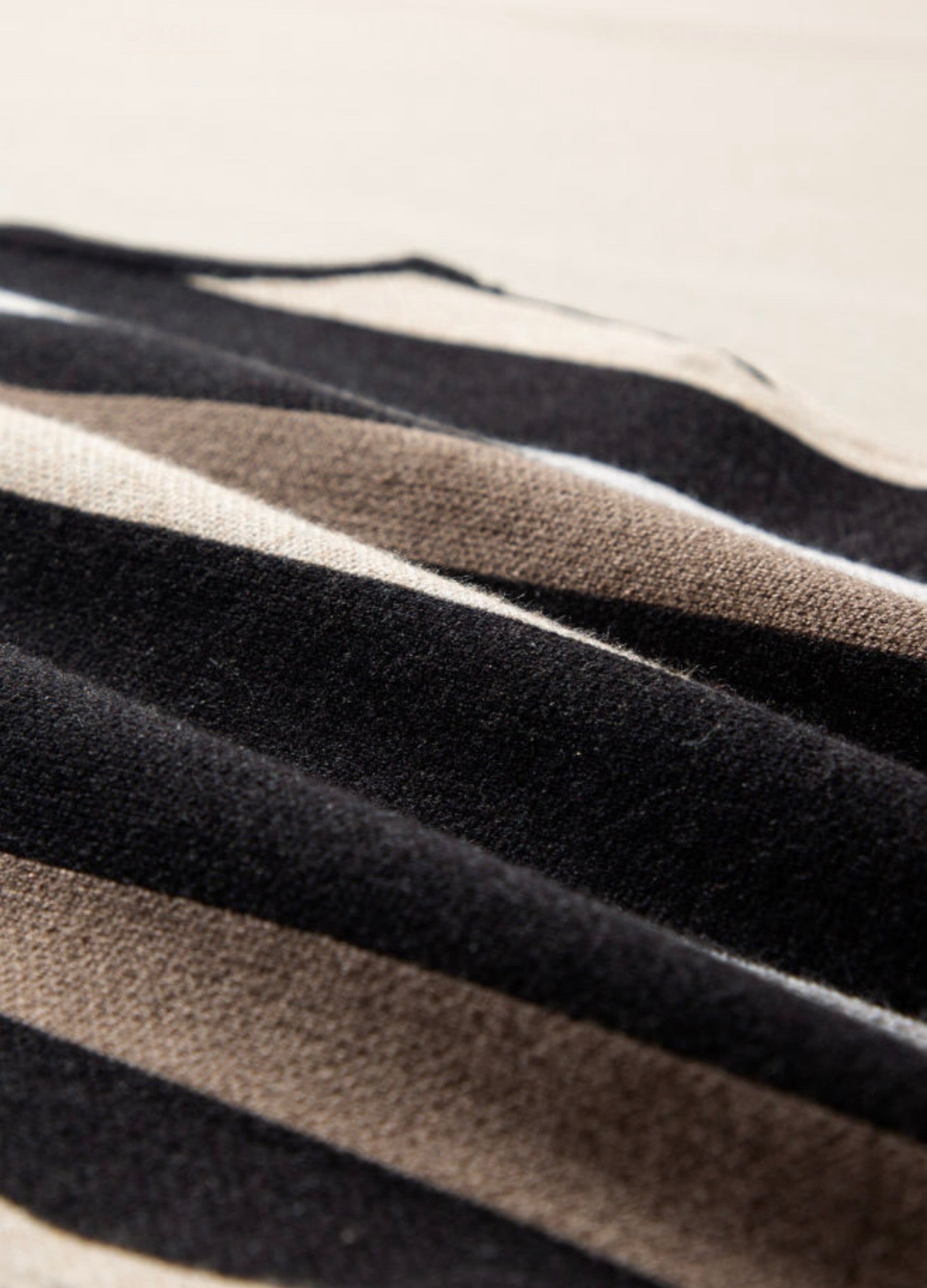 Black sleeveless sweater with Brown Stripes