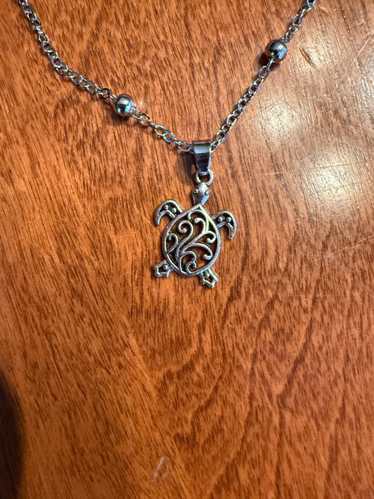 Sea turtle ankle bracelet by Ivy's Gifts & Boutique featuring a delicate design with sea turtle charms and adjustable cord.