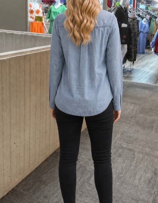 Lightweight soft denim button-up shirt from Ivy's Gifts & Boutique, versatile Vetsatile design with classic collar and long sleeves.