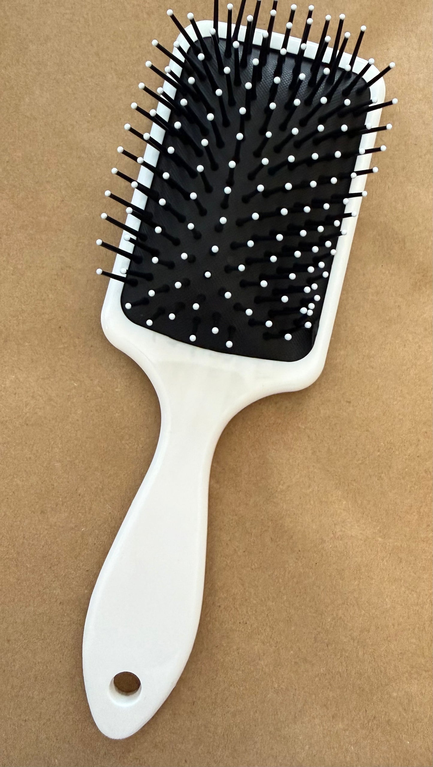 Sea turtle-shaped hair brush from Ivy's Gifts & Boutique, with wooden handle and soft bristles for gentle hair detangling.