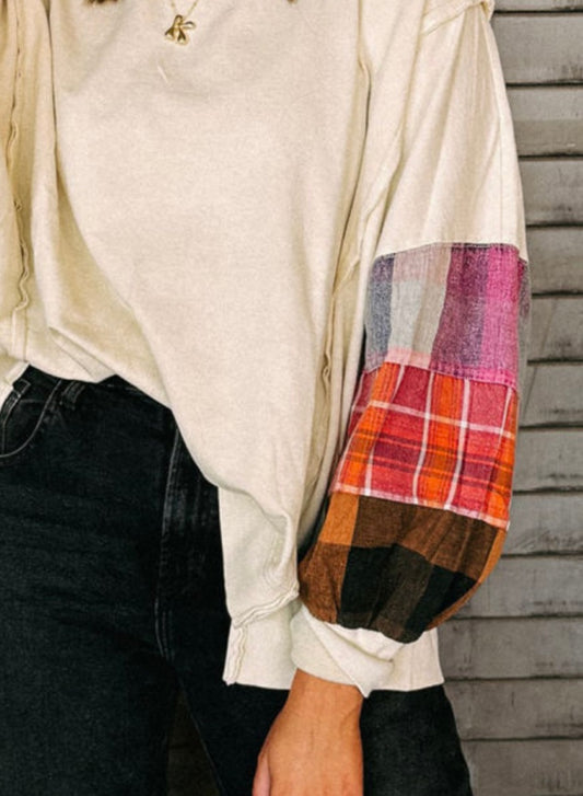 Cream top with color block/plaid sleeves