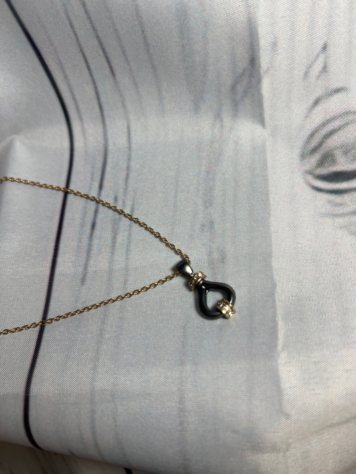 Matte black and gold with diamonds necklace