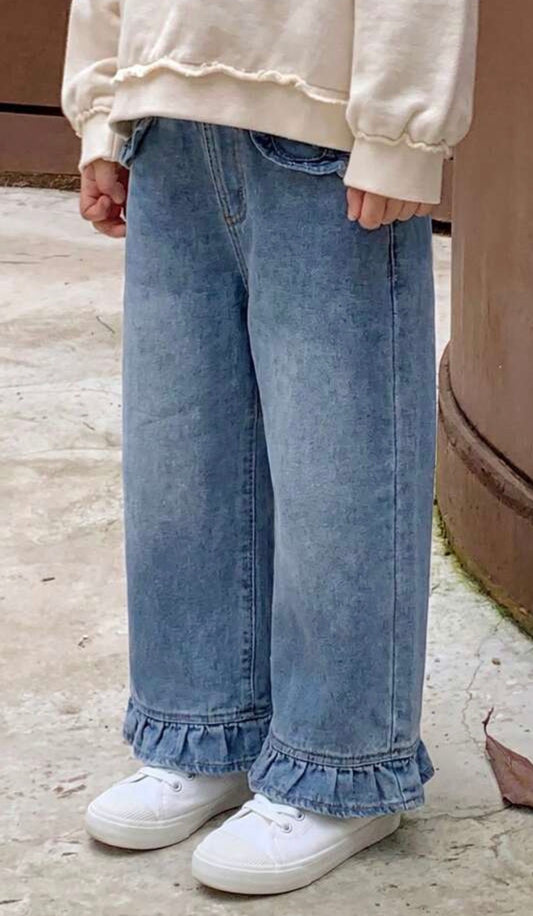 Medium wash denim pants with ruffle hem and pocket details from Ivy's Gifts & Boutique, showcasing stylish casual denim style.