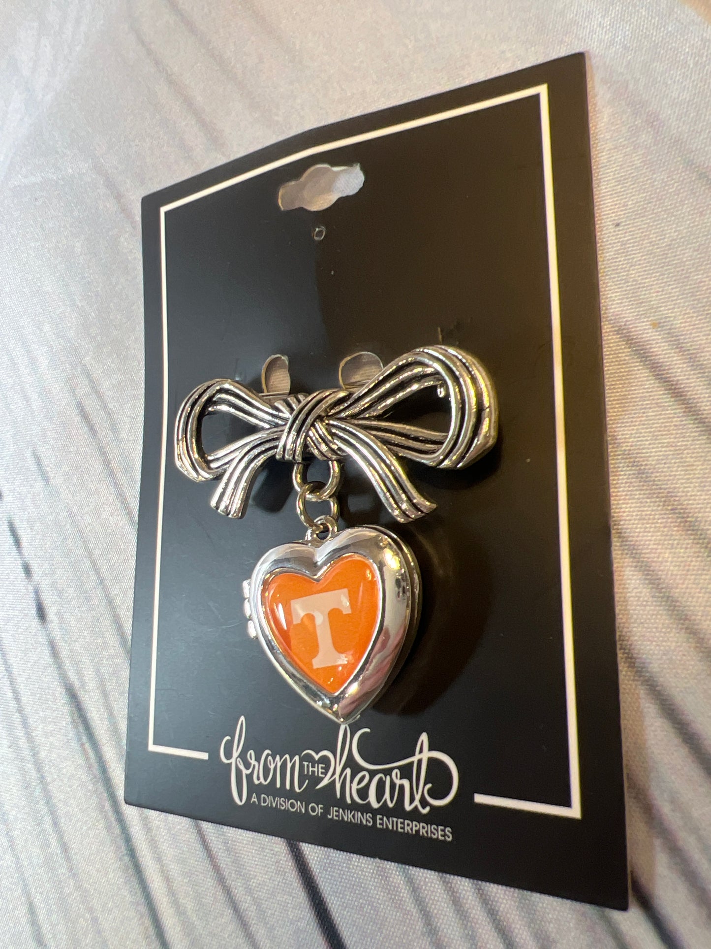 UT bow pin with heart locket