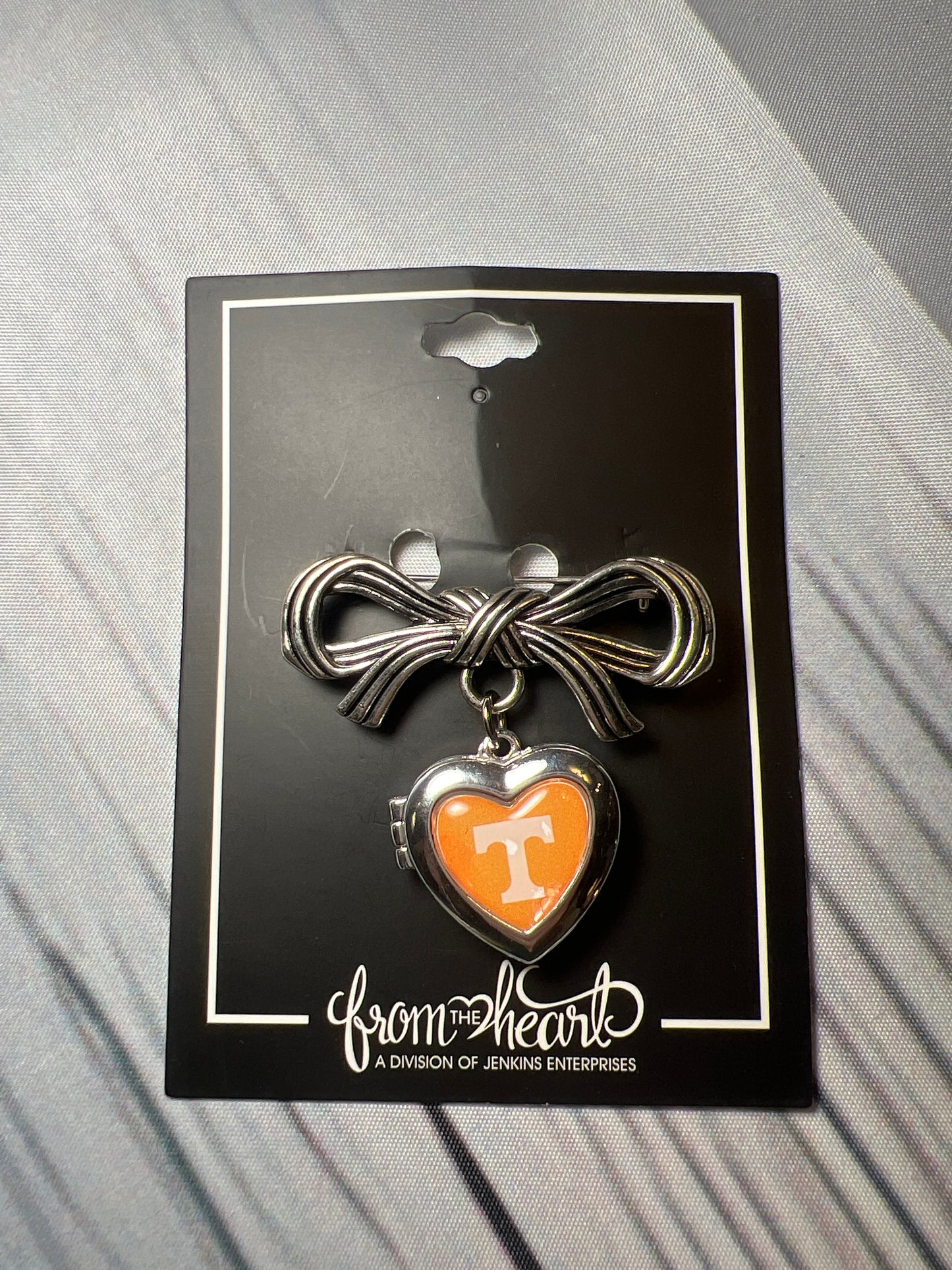 UT bow pin with heart locket
