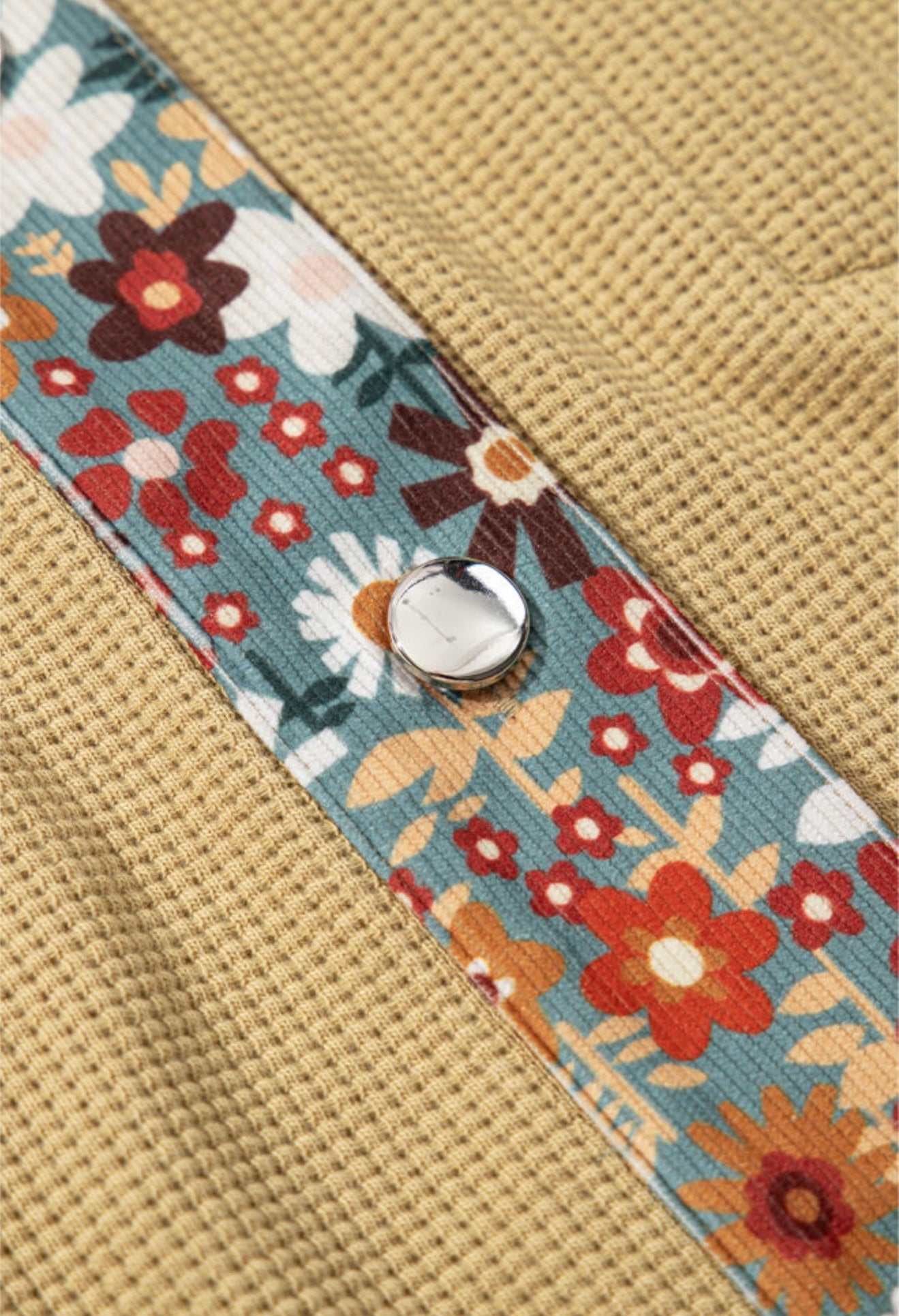 Tan waffle weave jacket with floral sleeves