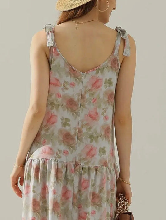 Floral maxi dress with A118 shoulder strap tie detail from Ivy's Gifts & Boutique, featuring a flowing design and vibrant floral pattern.