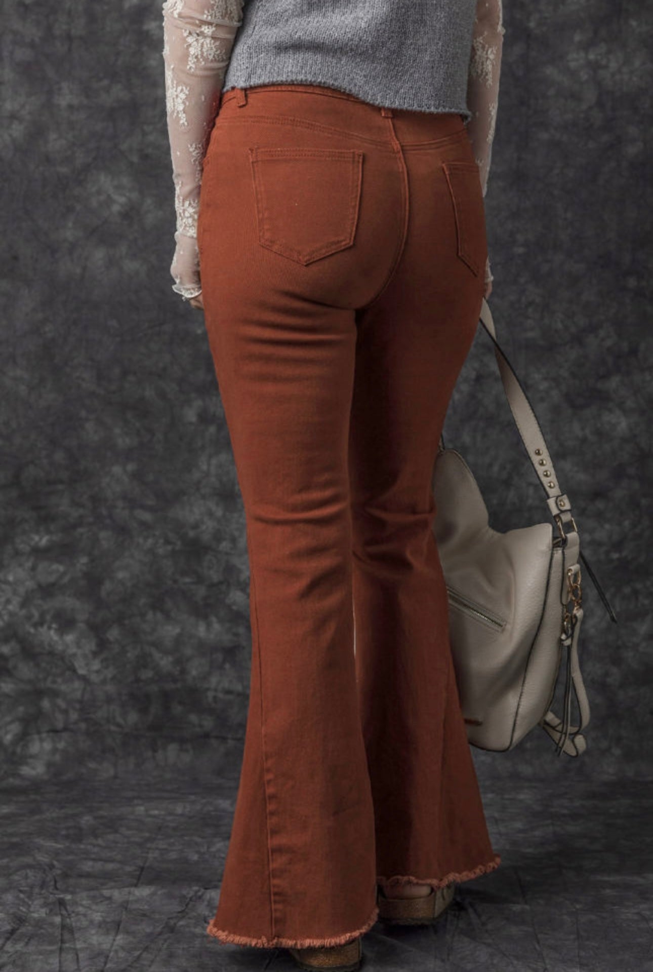 Rust Bell Bottom Jeans with frayed edge
