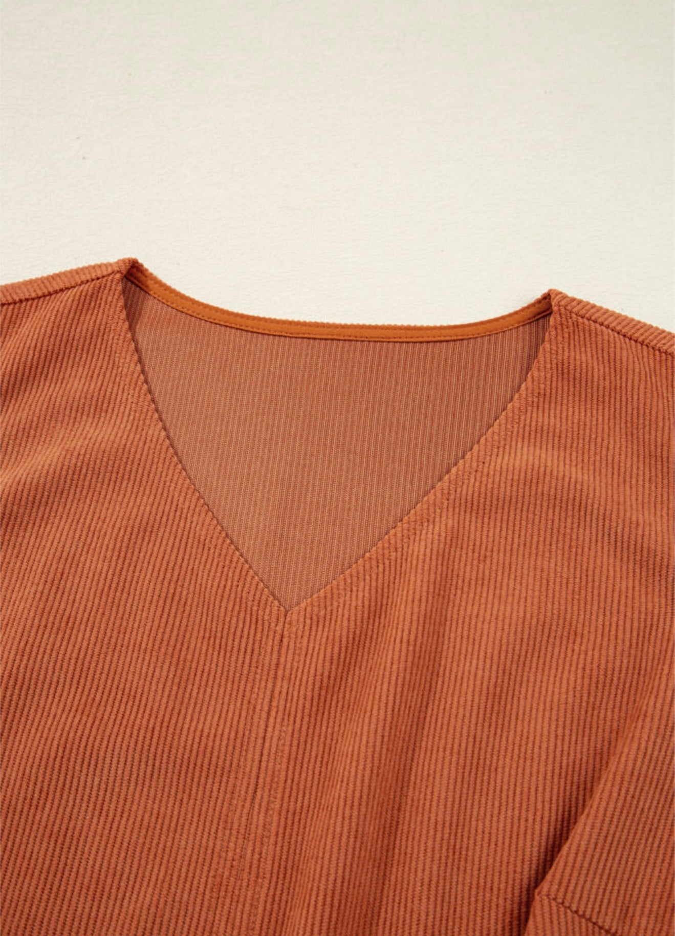 Sleeveless Rust colored dress with Accent Stitched Pocket Design