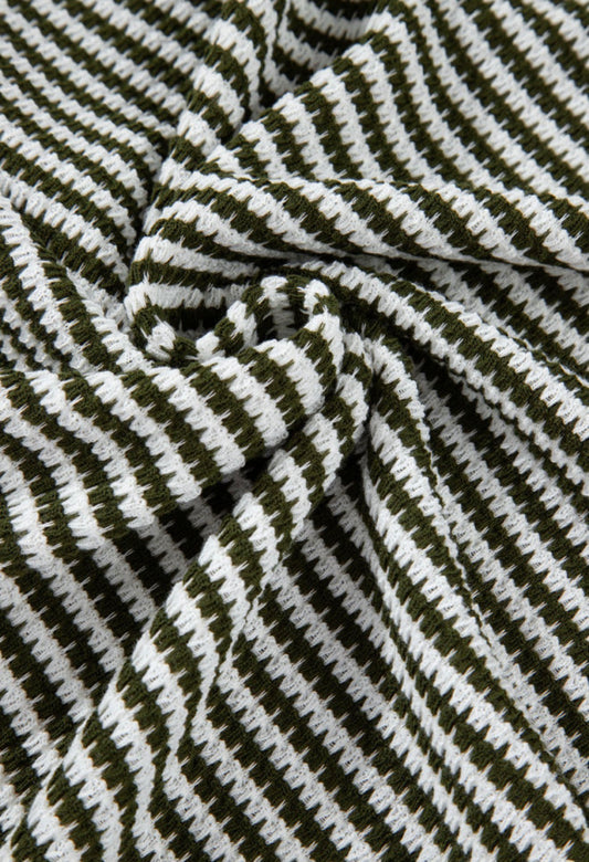 Green and white striped textured notched V-neck short sleeve top by Ivy's Gifts & Boutique, shown on a mannequin.