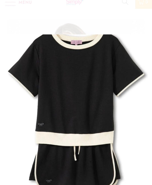 Black and ivory trimmed two-piece skort set by Ivy's Gifts & Boutique, featuring a stylish skirt and matching top.