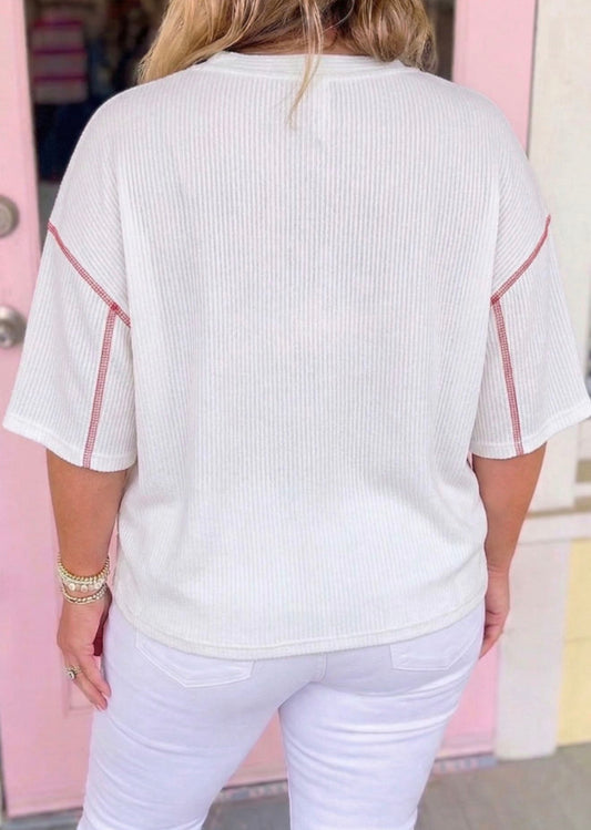 Twisted ribbed textured fabric with vintage print and oversized comfy cut, by Ivy's Gifts & Boutique, shown in close-up image.