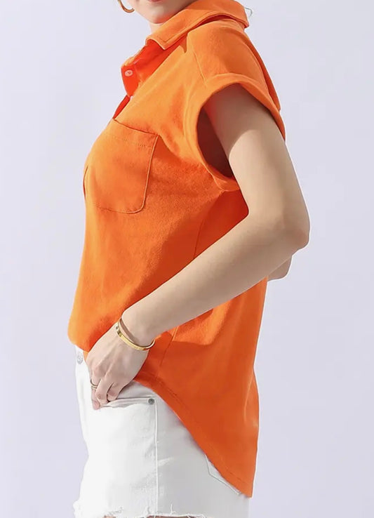 Orange cotton collar shirt with half button neck and front pocket from Ivy's Gifts & Boutique.