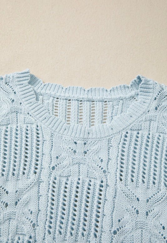 Light blue summer sweater with side tie accents from Ivy's Gifts & Boutique, featuring a relaxed fit and casual style.