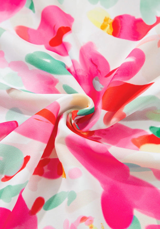 Bright floral print short sleeve blouse from Ivy's Gifts & Boutique, featuring a stylish and colorful design.