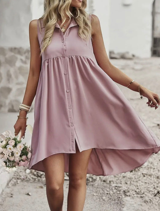 Pink sleeveless dress with collar and button front, featuring a stylish design perfect for warm weather outings.