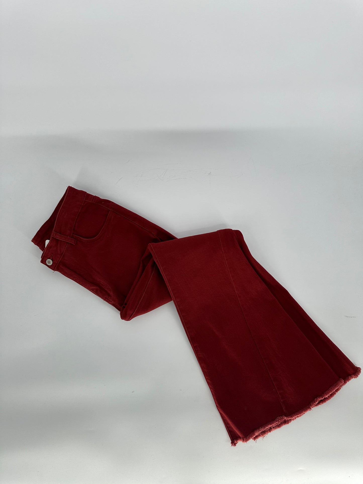 Rust Bell Bottom Jeans with frayed edge