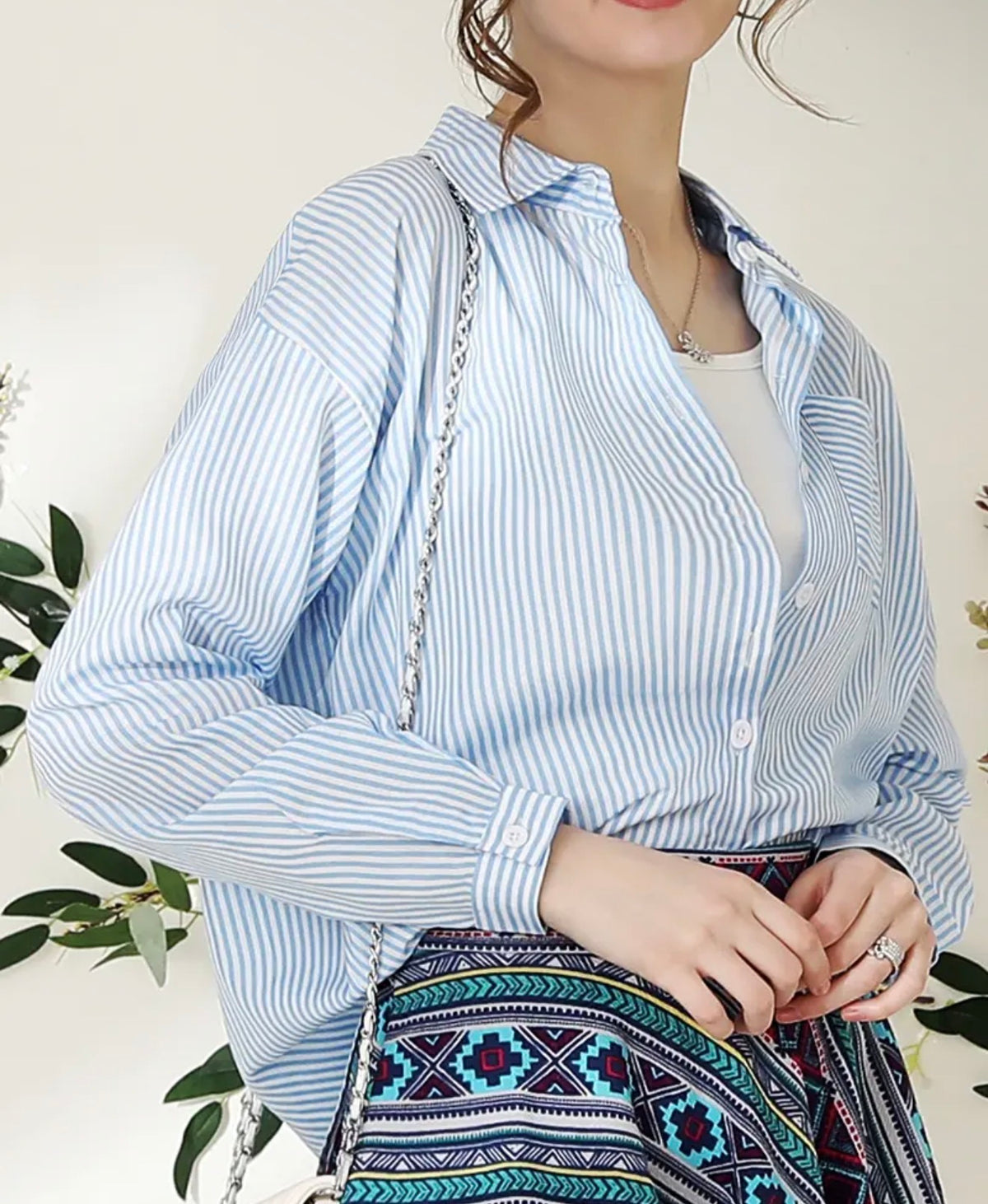 Blue striped button-up blouse from Ivy's Gifts & Boutique, versatile women's top with classic collar and long sleeves.