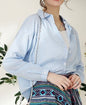 Blue striped button-up blouse from Ivy's Gifts & Boutique, versatile women's top with classic collar and long sleeves.