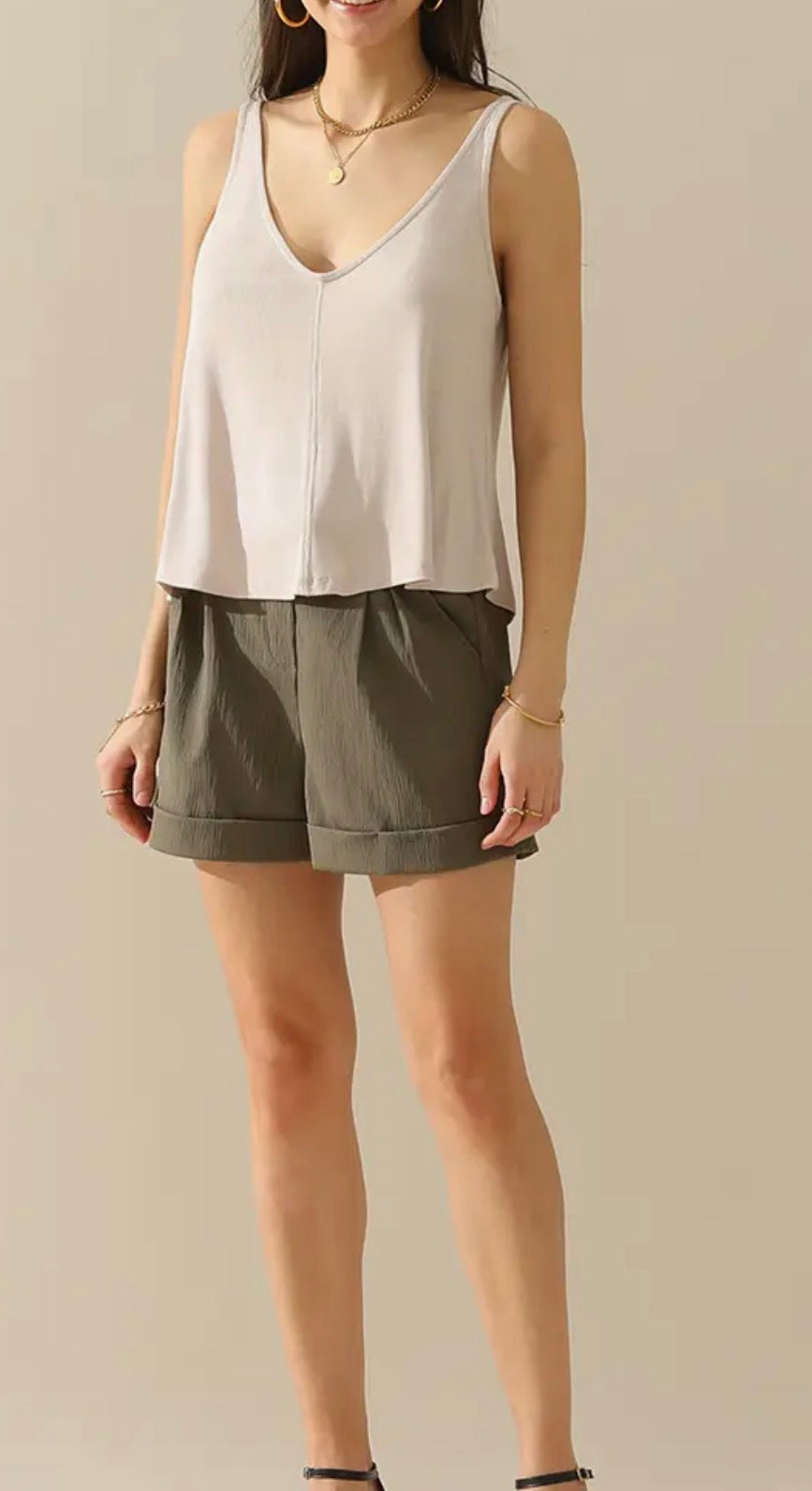 Ivy's Gifts & Boutique FR26 V-neck sleeveless loose-fit versatile dressy tank top on a hanger, showcasing soft fabric and relaxed fit.