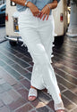 White jeans from Ivy's Gifts & Boutique featuring side seam bow details, slim fit with classic five-pocket design.