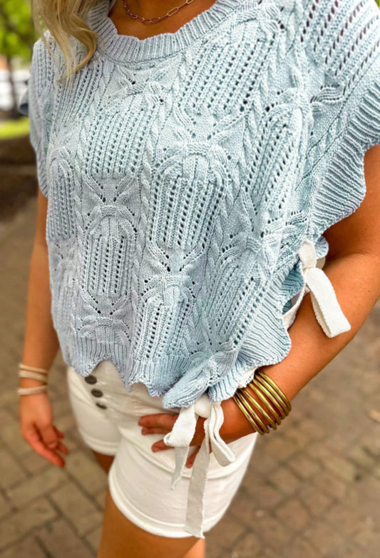 Light blue summer sweater with side tie accents from Ivy's Gifts & Boutique, featuring a relaxed fit and soft knit fabric.