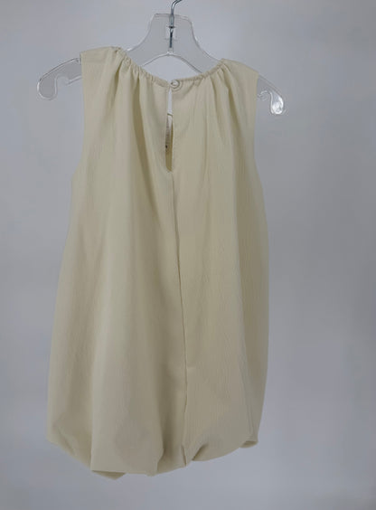 Ivory bubble hem dress with bow accents from Ivy's Gifts & Boutique, featuring a stylish and playful design for special occasions.
