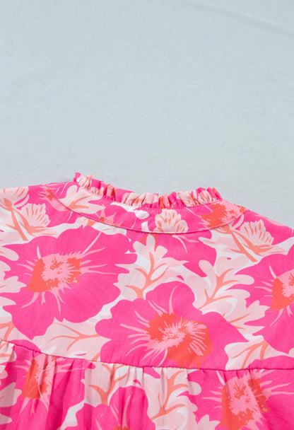 Pink and orange floral bubble sleeve summer top by Ivy's Gifts & Boutique, featuring short sleeves and vibrant floral pattern.