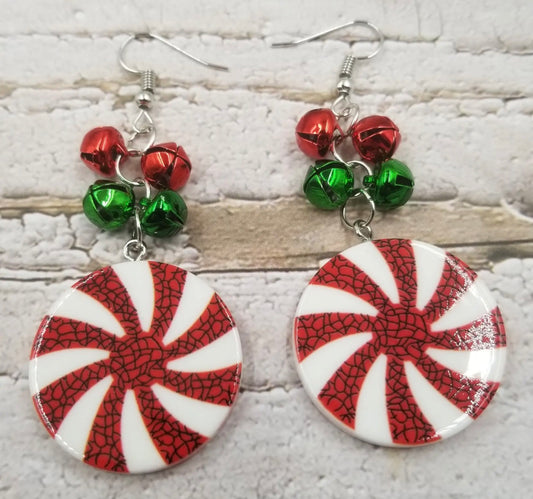 Ivy's Gifts & Boutique peppermint candy disc earrings with red and white striped design, hanging on silver hooks.