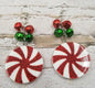Ivy's Gifts & Boutique peppermint candy disc earrings with red and white striped design, hanging on silver hooks.