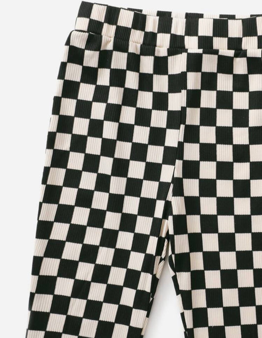 Black and white checkerboard print ribbed knit pants from Ivy's Gifts & Boutique, featuring a snug, textured fit.