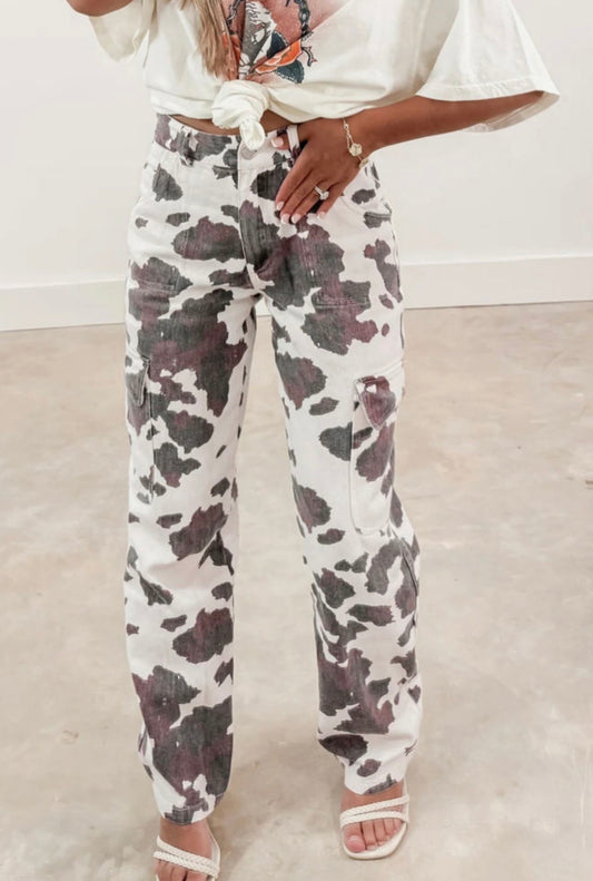 A110 cow print cargo pants featuring a side pocket, designed by Ivy's Gifts & Boutique.
