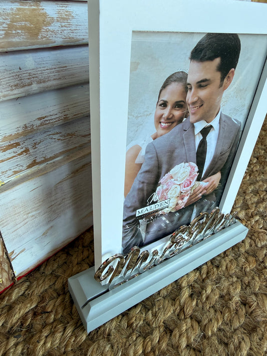 Mr. & Mrs. 5x7 platform style picture frame with silver metal script detail by Ivy's Gifts & Boutique.