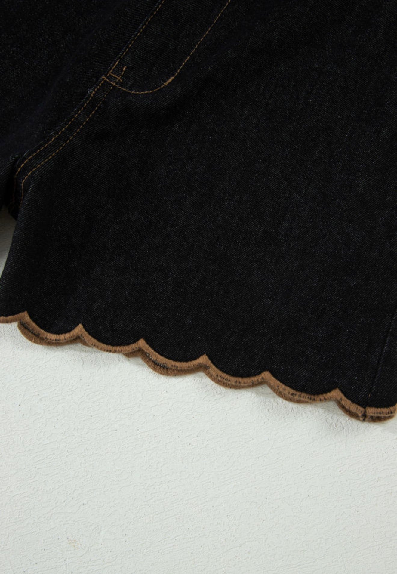 Black stretch denim scallop hem shorts from Ivy's Gifts & Boutique, featuring a stylish scalloped edge and fitted design.