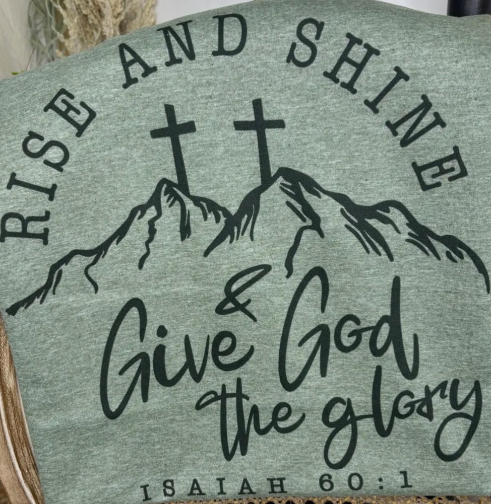 Inspirational wall art with the phrase "Rise and Shine…Give God the Glory" from Ivy's Gifts & Boutique, featuring vibrant lettering and design.