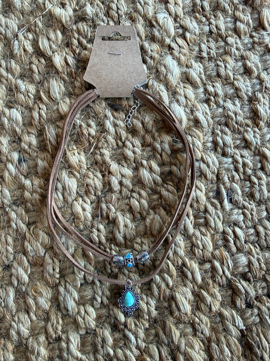 Double strand faux turquoise necklace from Ivy's Gifts & Boutique featuring vibrant turquoise beads and silver accents.
