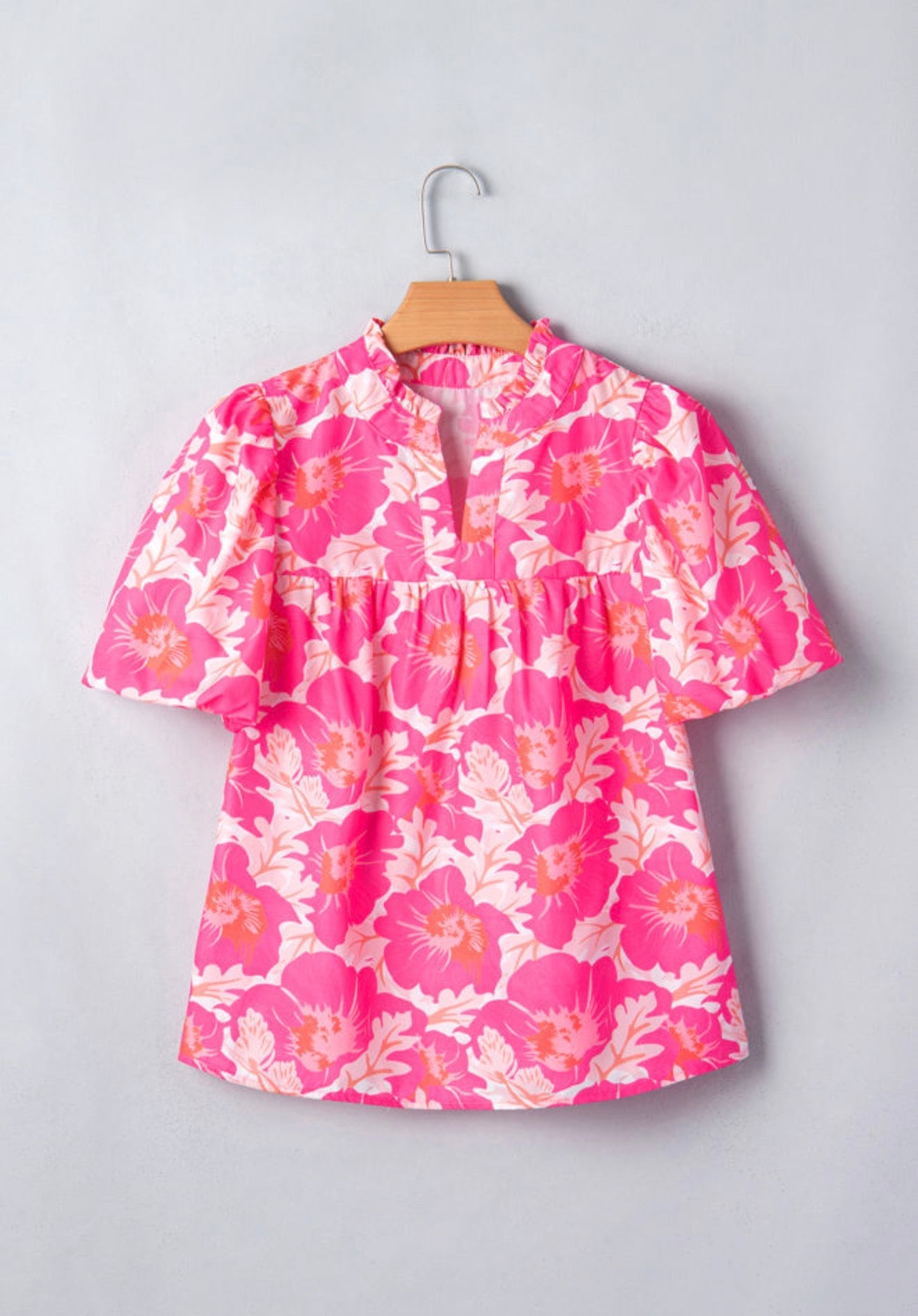 Pink and orange floral summer top with bubble sleeves from Ivy's Gifts & Boutique, featuring a short, stylish design.