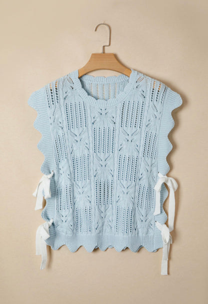 Light blue summer sweater from Ivy's Gifts & Boutique featuring side tie accents and a relaxed, stylish fit.