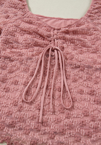 Pink floral lace top with flattering neckline, designed by Ivy's Gifts & Boutique, showcasing intricate lace details.