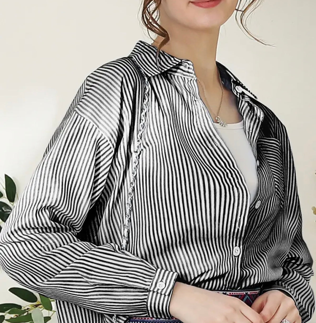 Black stripe button-down blouse by Ivy's Gifts & Boutique, featuring stylish design and versatile fashion options.