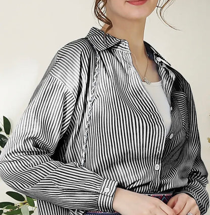 Black stripe button-down blouse by Ivy's Gifts & Boutique, featuring stylish design and versatile fashion options.