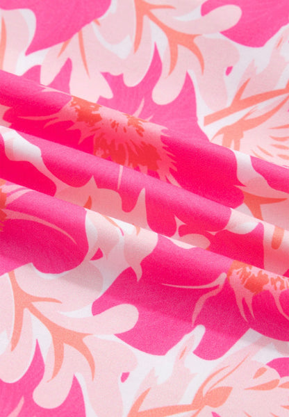 Pink and orange floral bubble sleeve summer top from Ivy's Gifts & Boutique, featuring a short fit and vibrant floral pattern.