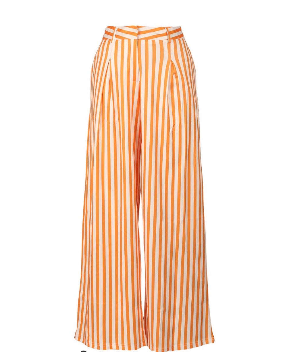 Orange and white striped wide-leg pants by Ivy's Gifts & Boutique, featuring a flowing fit and stylish stripe pattern.
