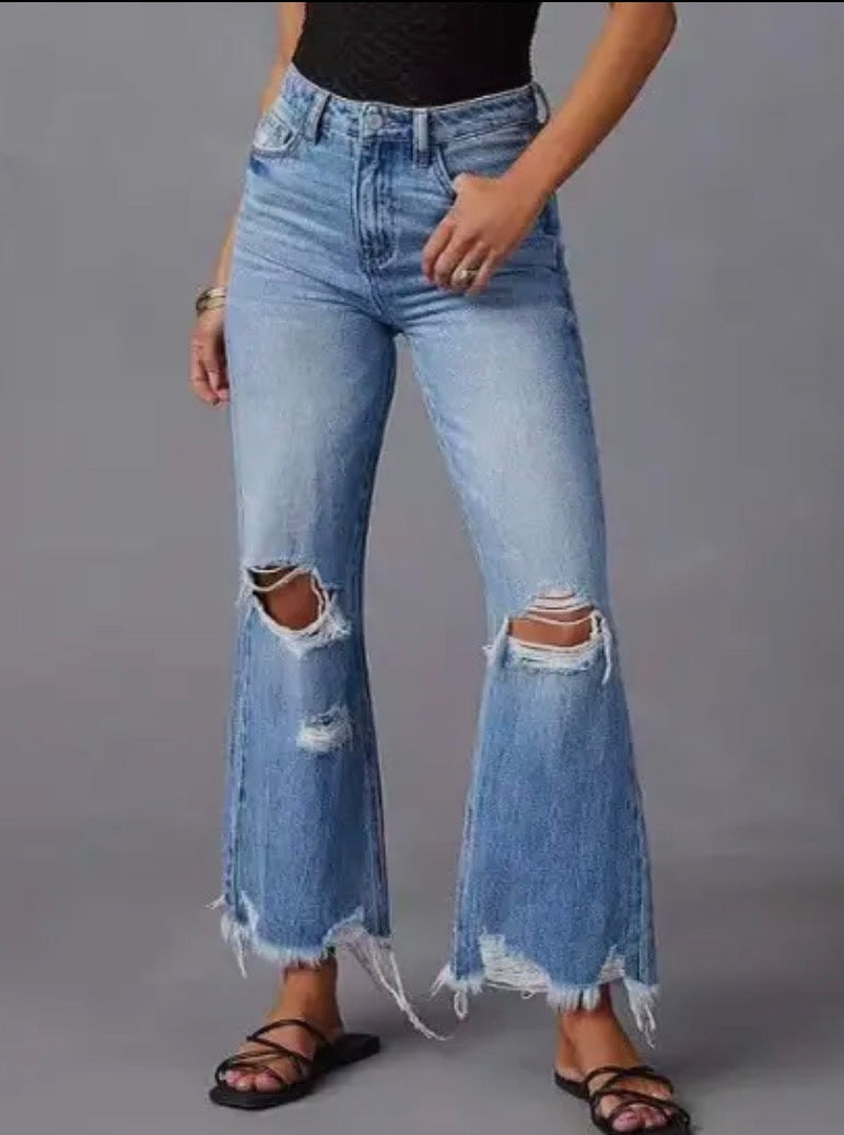 Light wash A113 distressed wide-leg jeans with fray hem by Ivy's Gifts & Boutique, showing front view with distressed details