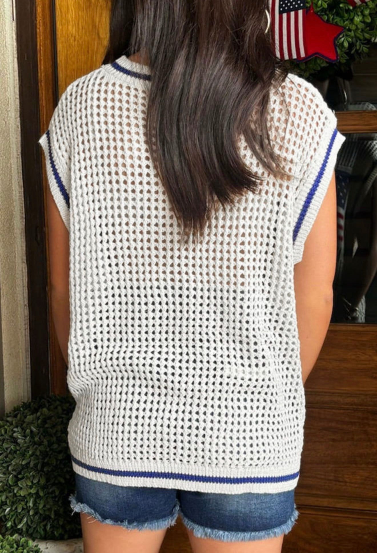 Open weave sleeveless sweater featuring the American flag design by Ivy's Gifts & Boutique, with a lightweight, patriotic style.