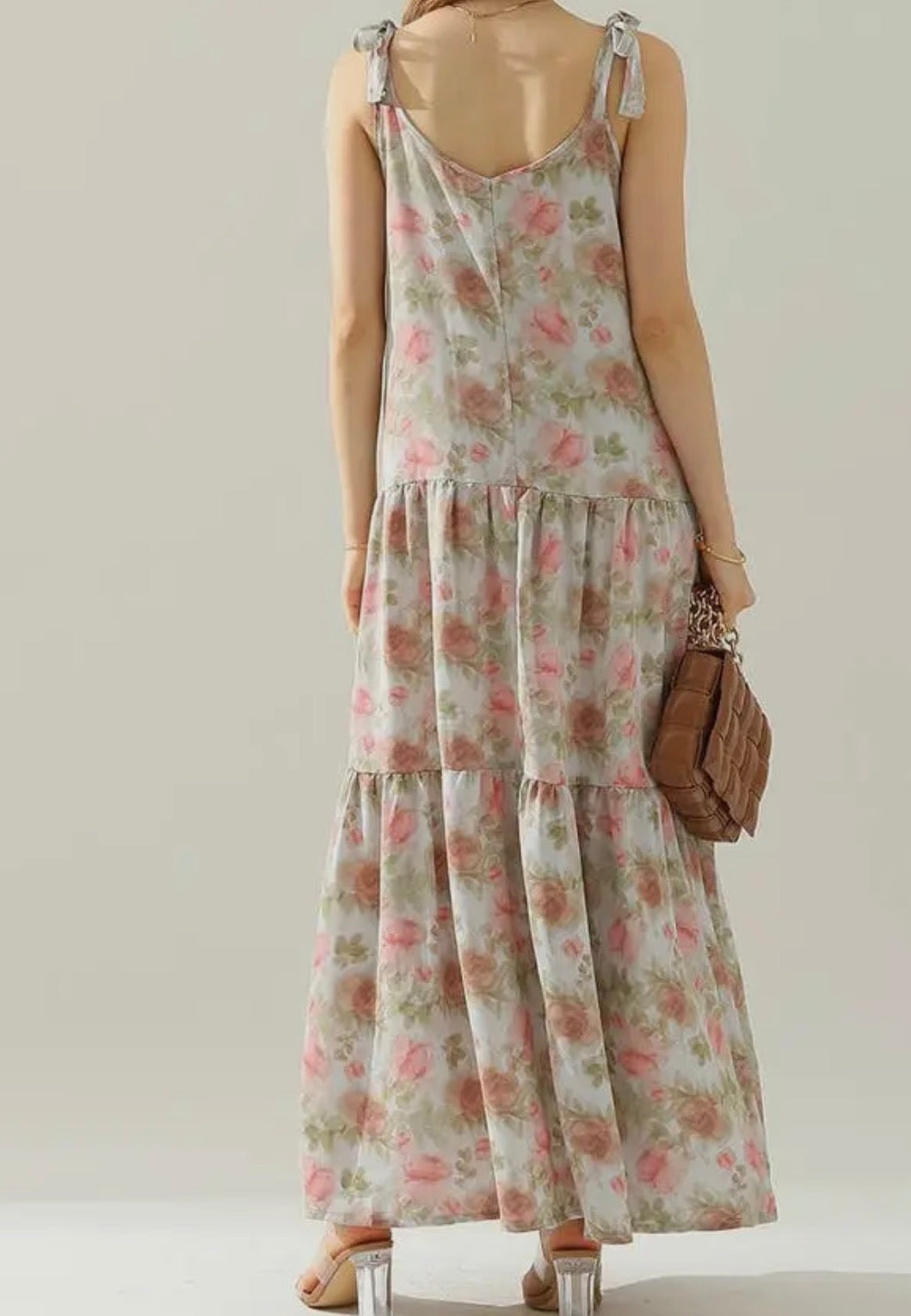 Floral maxi dress with A118 shoulder strap tie detail by Ivy's Gifts & Boutique, featuring a flowing fabric and vibrant floral pattern.
