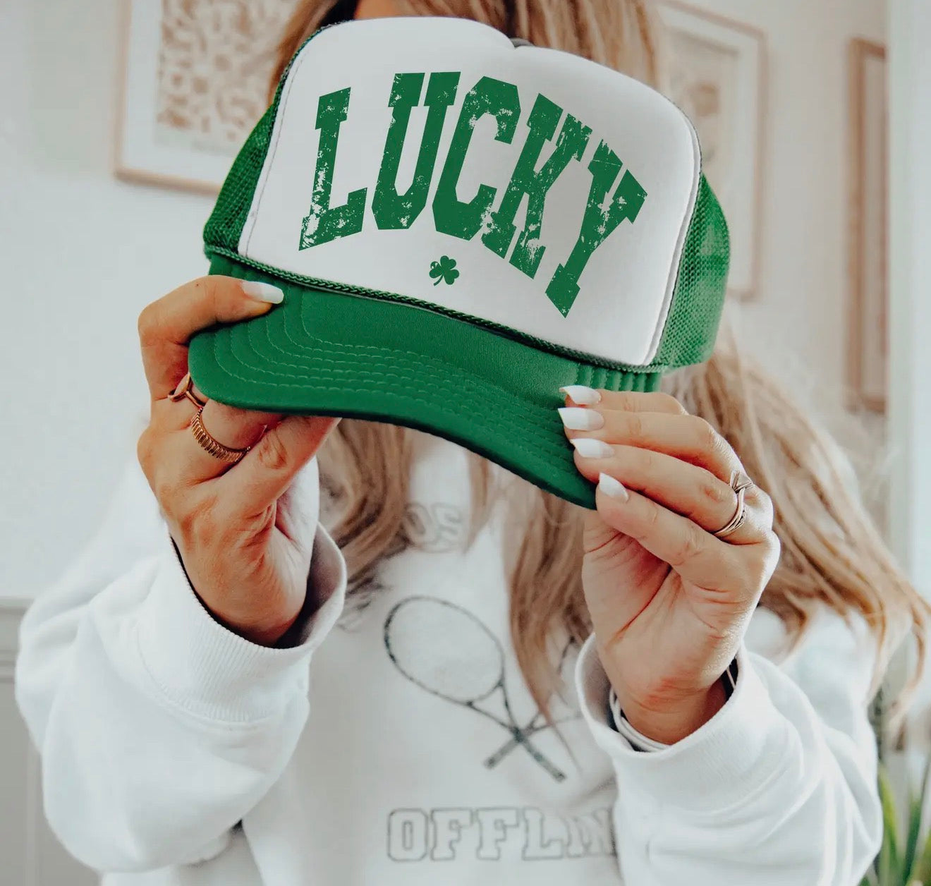 A99 LUCKY trucker style cap featuring a mesh back and adjustable snap closure in a casual design.