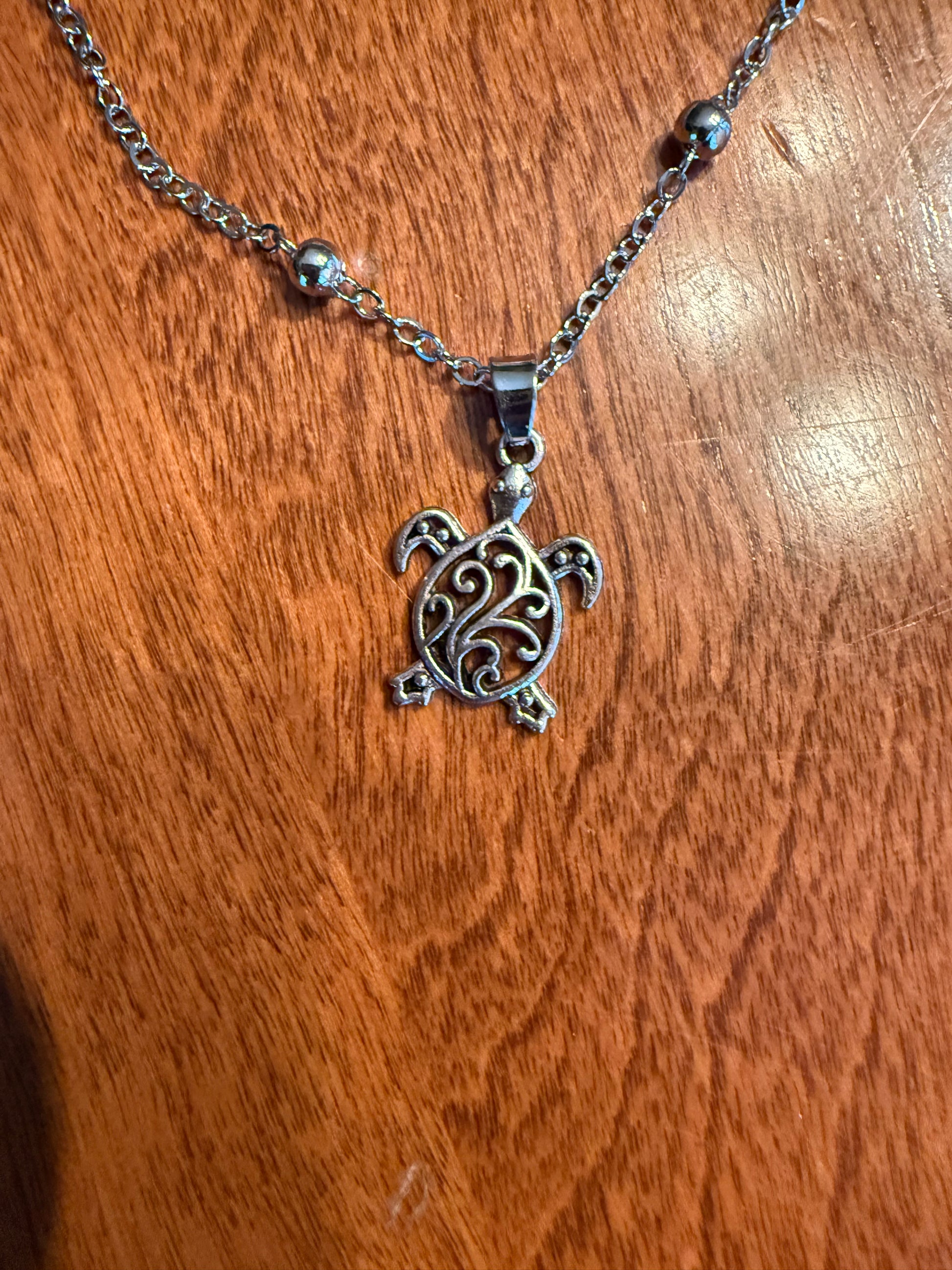 Sea turtle ankle bracelet by Ivy's Gifts & Boutique featuring a delicate design with sea turtle charms and adjustable cord.